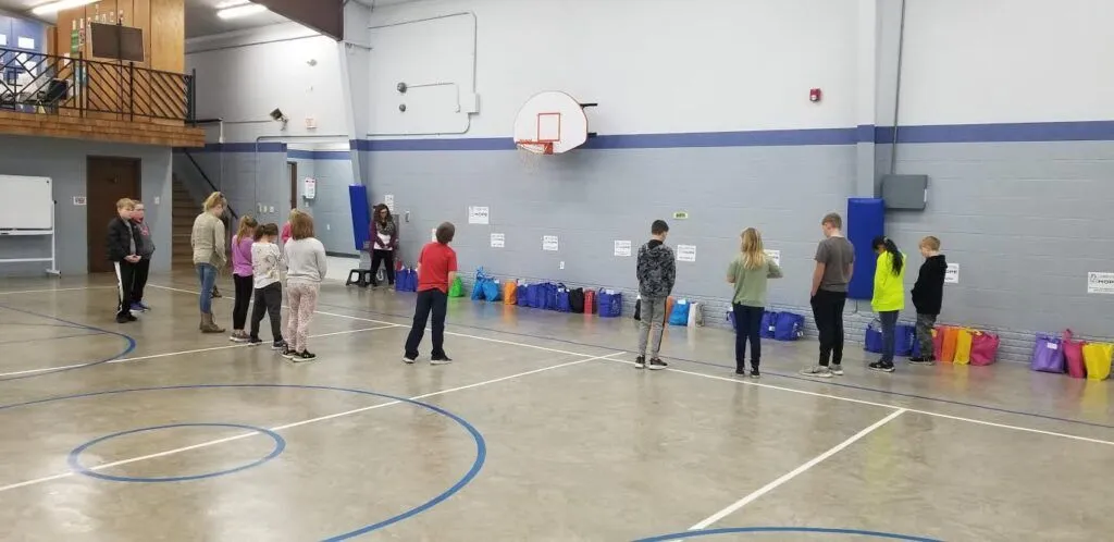 kids playing a game in the gym